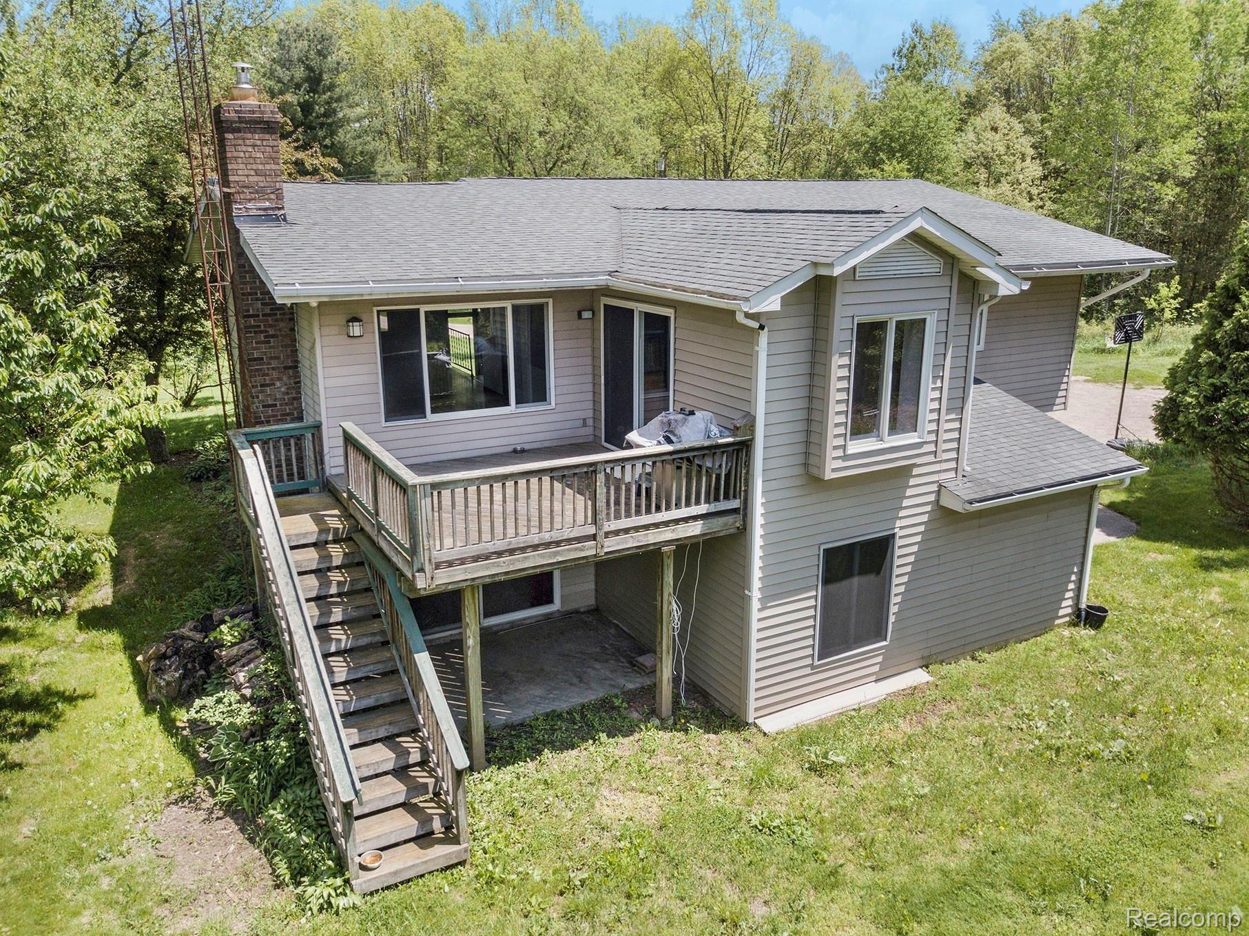 800 Sleaford Road Howell, MI 48843 - Photo 26 of 29 upper deck and lower level with doorwall to family room.