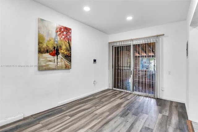 a view of entryway with wooden floor