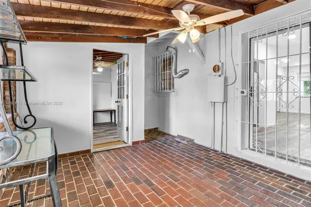 a view of a hallway with entryway wooden floor and front door