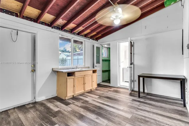 a kitchen with sink cabinets and refrigerator