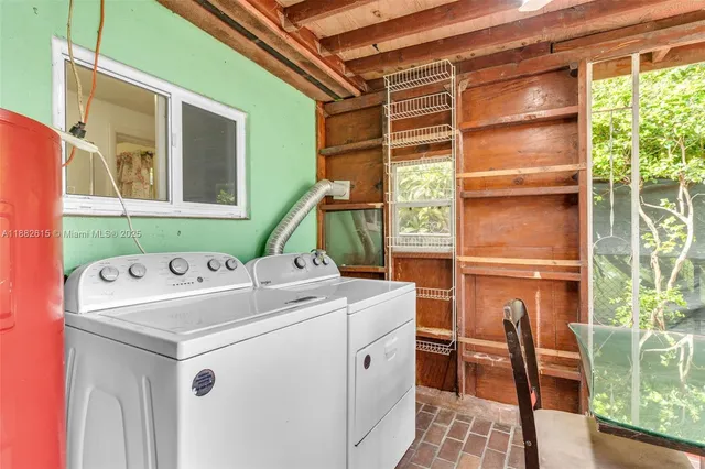 a view of a house with backyard and porch
