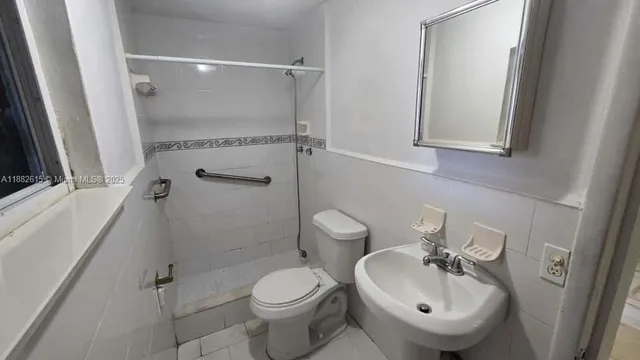 a view of a front door and wooden floor