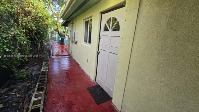 an aerial view of residential houses with outdoor space and street view