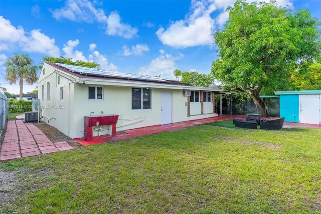 an aerial view of residential building and lake