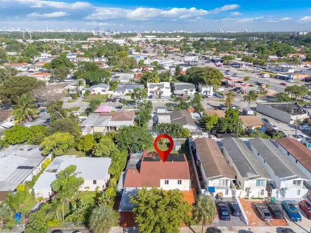 an aerial view of residential building and lake