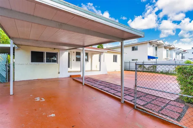 a view of a backyard with porch