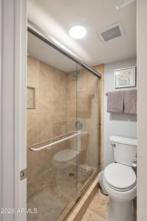 a view of storage and utility room with racks on the wall