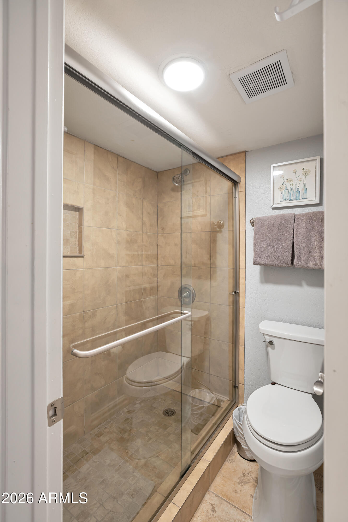 3825 East Camelback Road, Unit 218 Phoenix, AZ 85018 - Photo 11 of 28 a bathroom with a granite countertop toilet and a shower