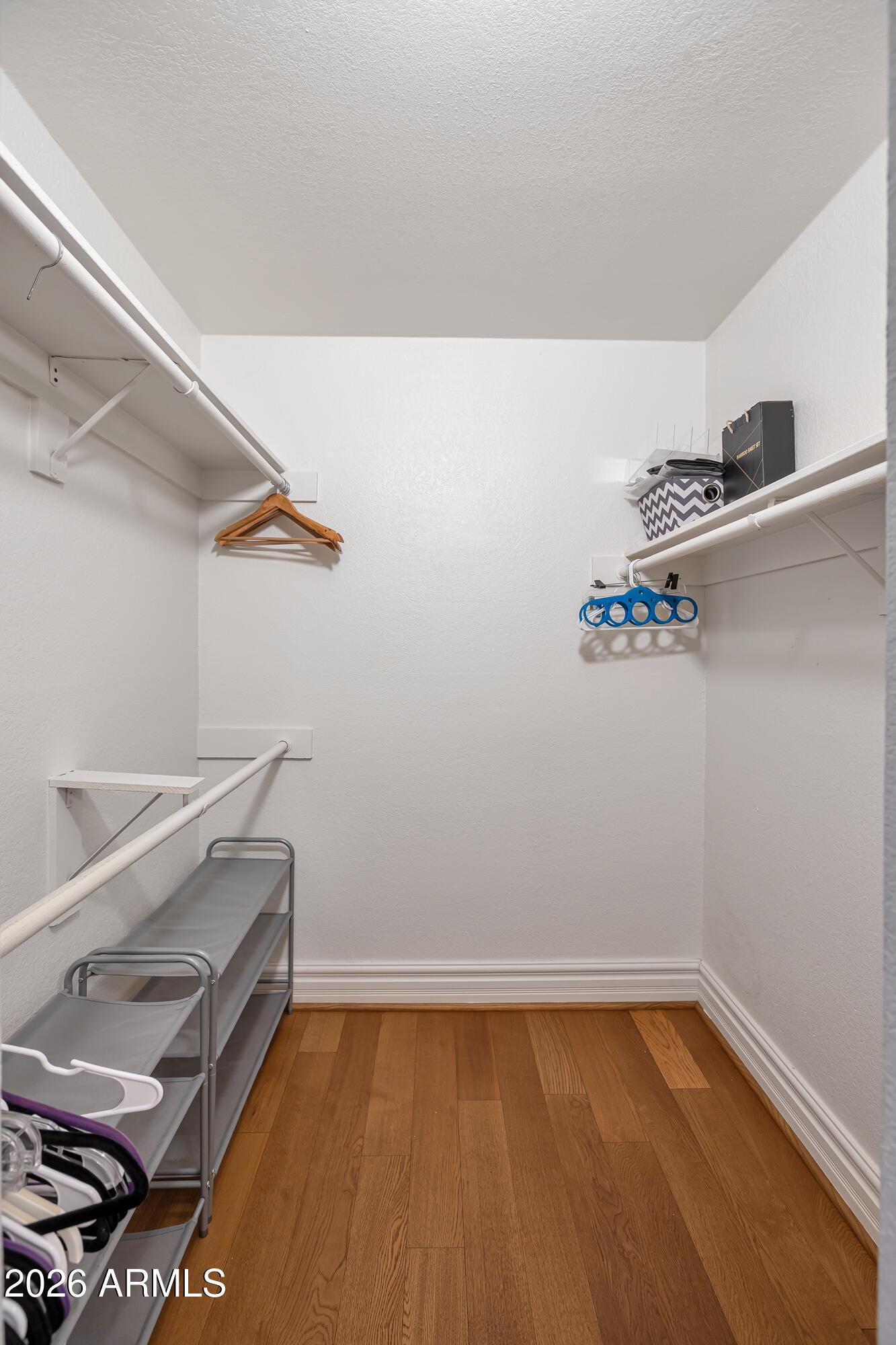 3825 East Camelback Road, Unit 218 Phoenix, AZ 85018 - Photo 12 of 28 a view of storage and utility room with racks on the wall