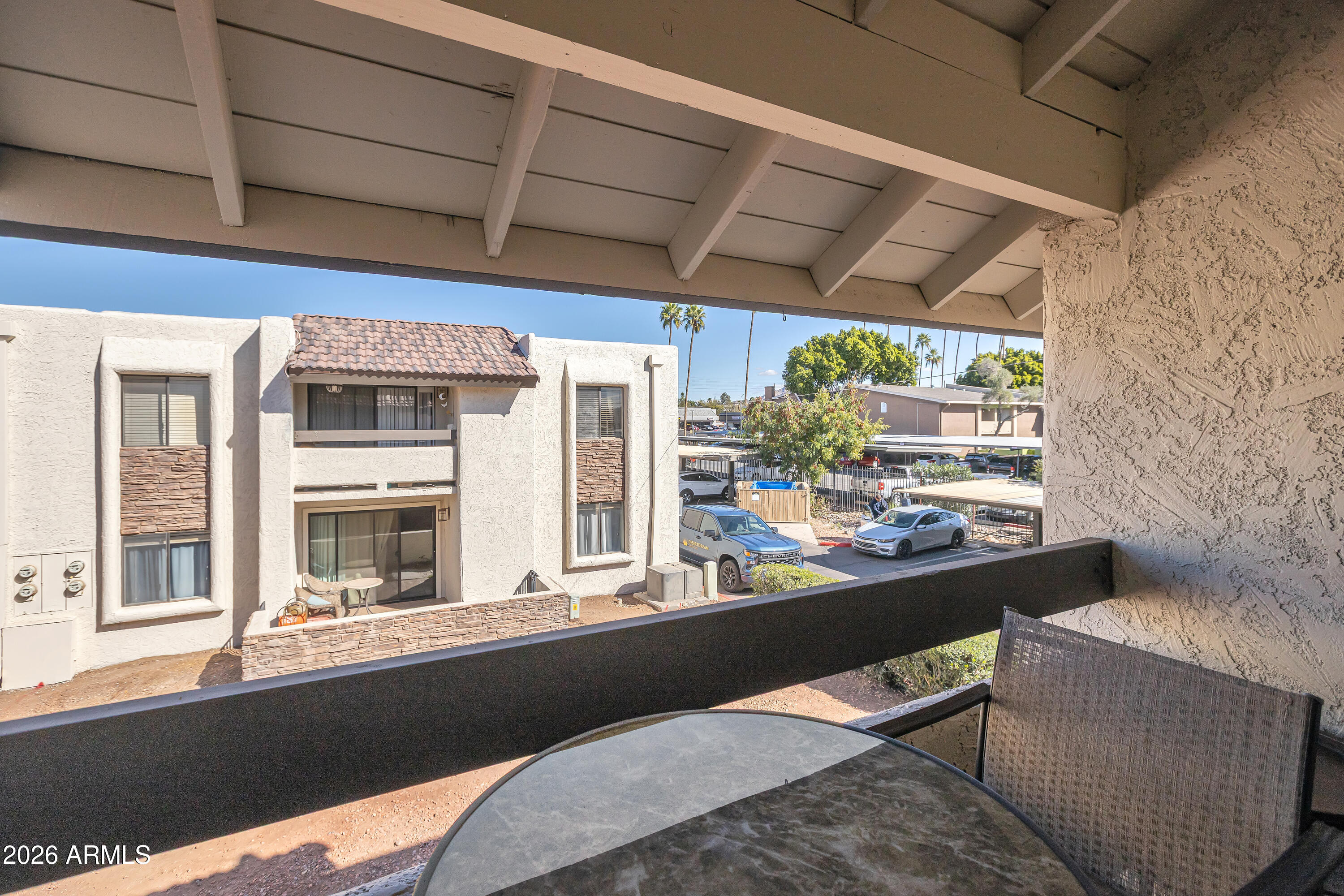 3825 East Camelback Road, Unit 218 Phoenix, AZ 85018 - Photo 20 of 28 a living room with a large window and furniture