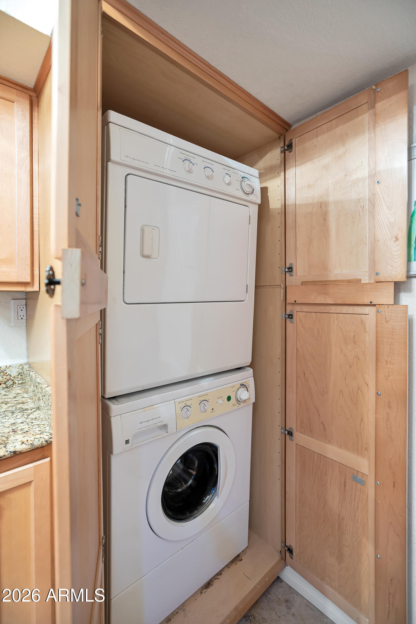 3825 East Camelback Road, Unit 218 Phoenix, AZ 85018 - Photo 21 of 28 a utility room with dryer and washer