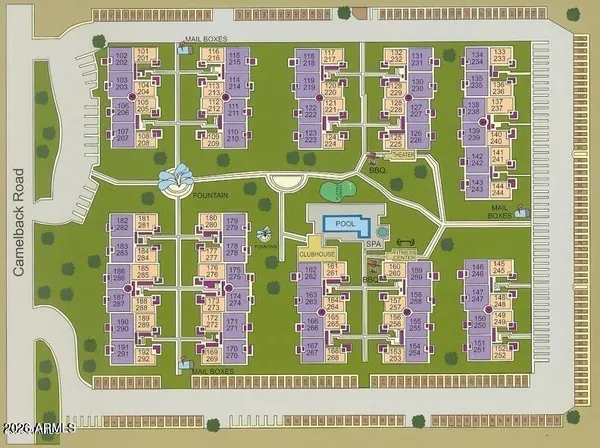 a view of a brick wall and a flower garden