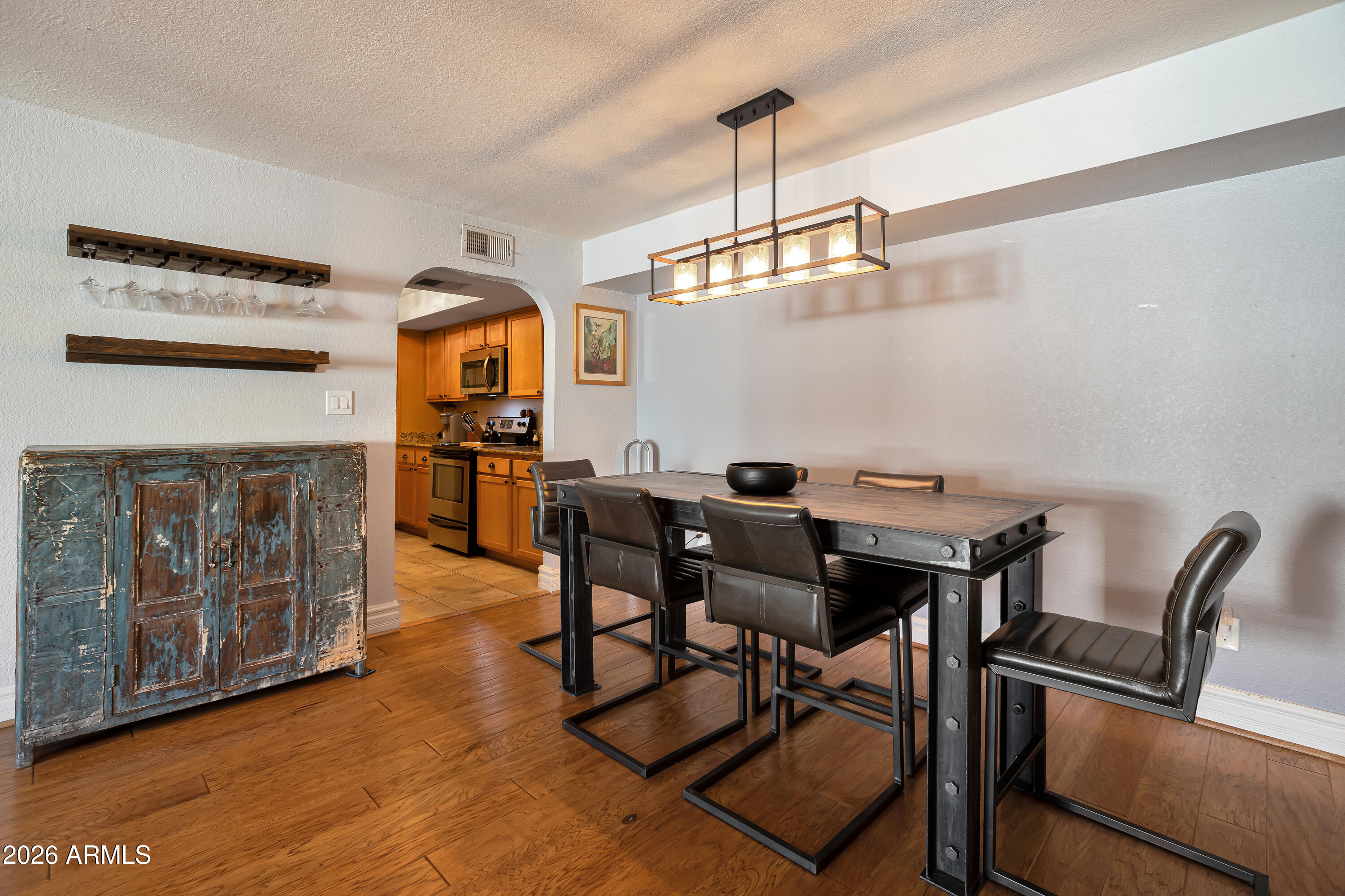 3825 East Camelback Road, Unit 218 Phoenix, AZ 85018 - Photo 6 of 28 a view of a dining room with furniture