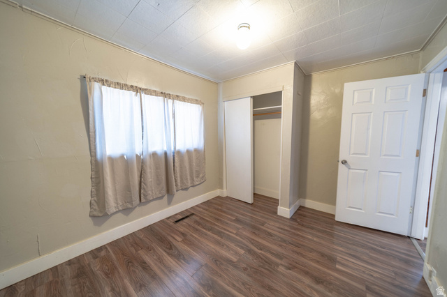 331 North 4th East Price, UT 84501 - Photo 5 of 7 Wood-finish flooring throughout, white trim, and a built-in closet with sliding doors