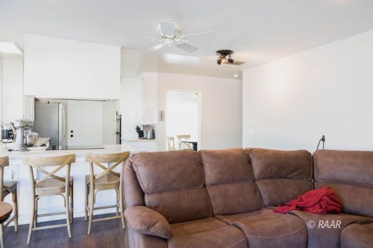 730 Scott Circle Ridgecrest, CA 93555 - Photo 11 of 32 a living room with furniture a dining table and chairs