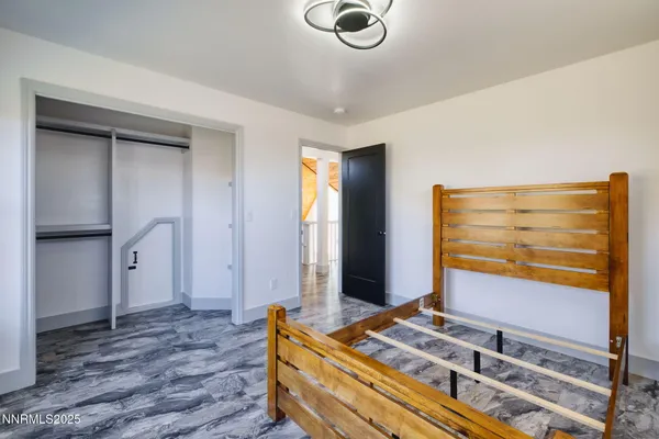 a bedroom with a bed and cabinets