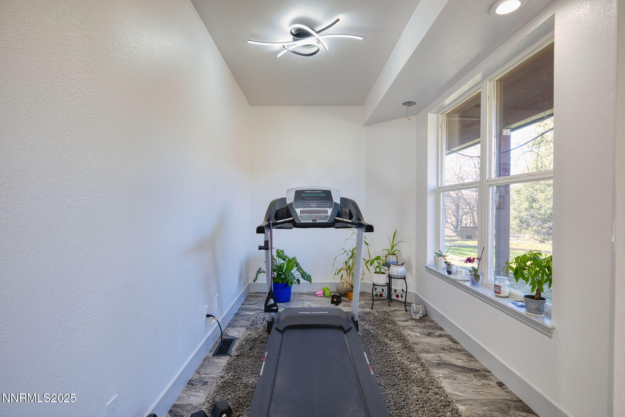 2988 Pine Valley Road Gardnerville, NV 89410 - Photo 12 of 21 a view of a workspace with furniture and a window