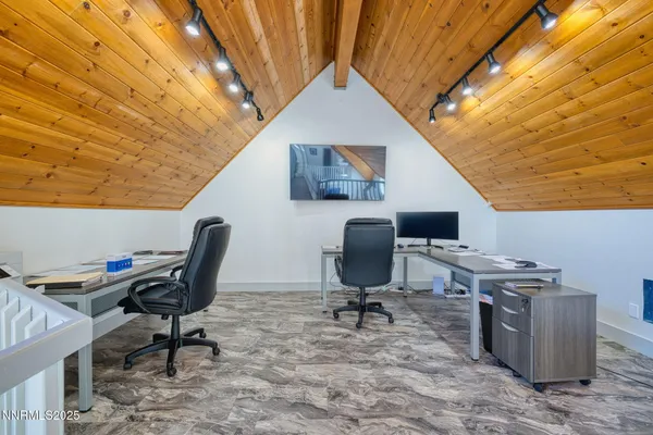 a view of a workspace with furniture