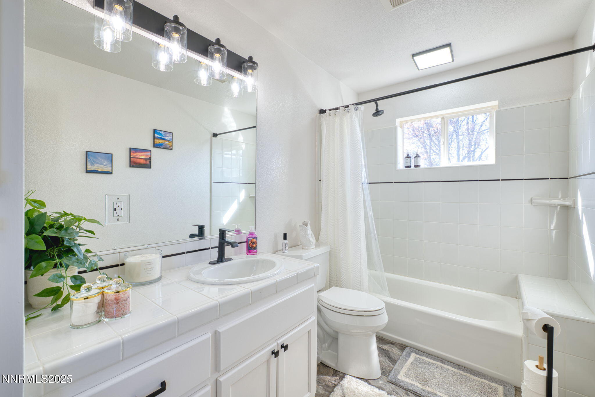 2988 Pine Valley Road Gardnerville, NV 89410 - Photo 10 of 21 a bathroom with a sink a large mirror and a shower