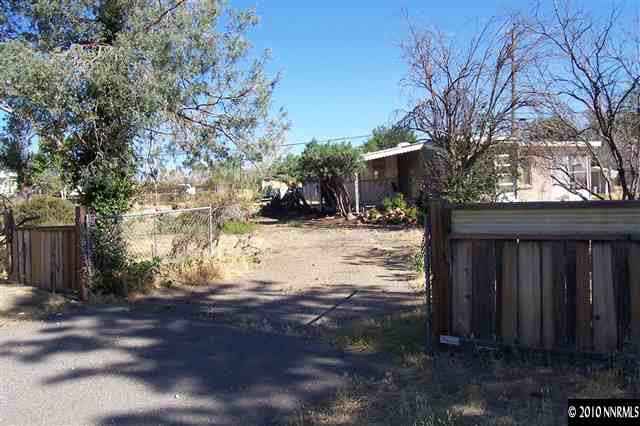 375 Zolezzi Lane Reno, NV 89511 - Photo 6 of 9 a view of a yard covered in snow