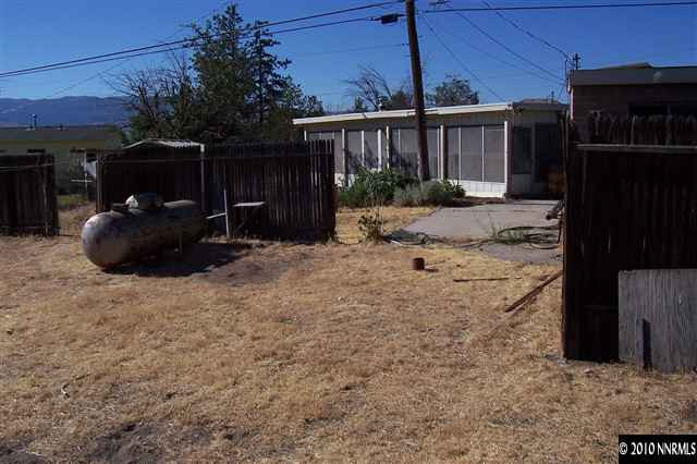 375 Zolezzi Lane Reno, NV 89511 - Photo 9 of 9 a backyard of a house with yard and outdoor seating