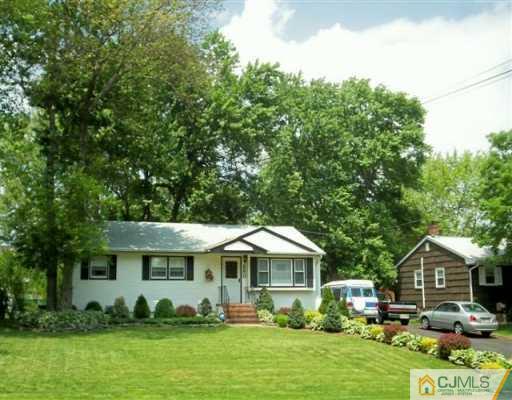 580 Old Post Road Edison, NJ 08817 - Photo 1 of 7 a front view of a house with garden