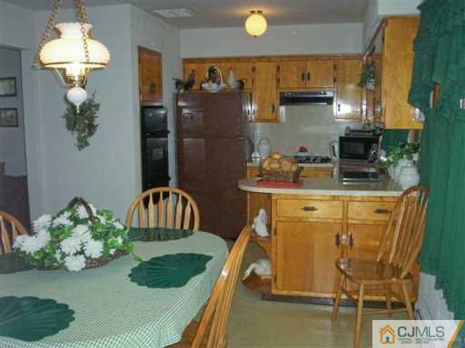 580 Old Post Road Edison, NJ 08817 - Photo 2 of 7 a kitchen with a refrigerator and a stove