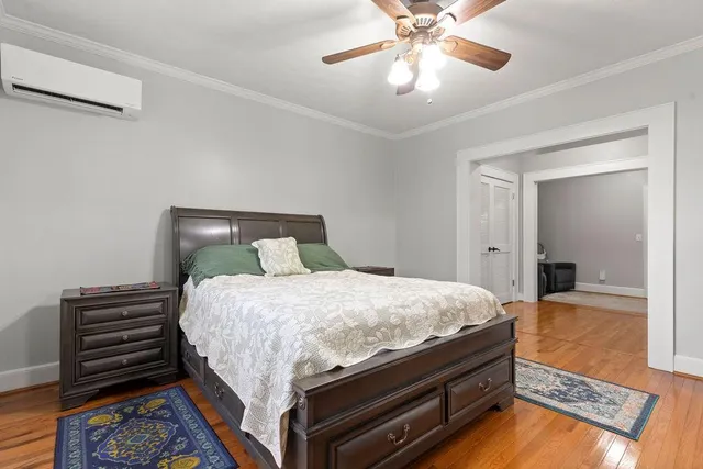a bed sitting in a bedroom and view of closet