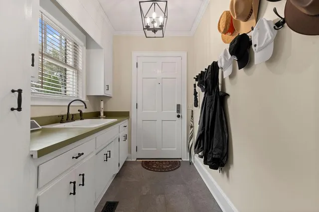 a bathroom with a double vanity sink and a mirror