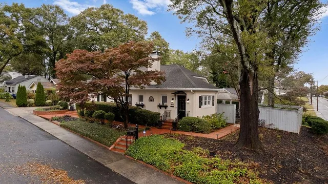 a front view of a house with garden