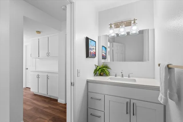 a bathroom with a sink a vanity and a mirror