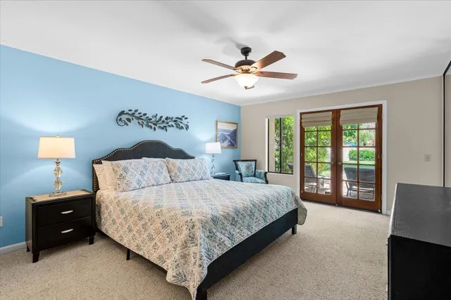 a bedroom with a bed and a tv