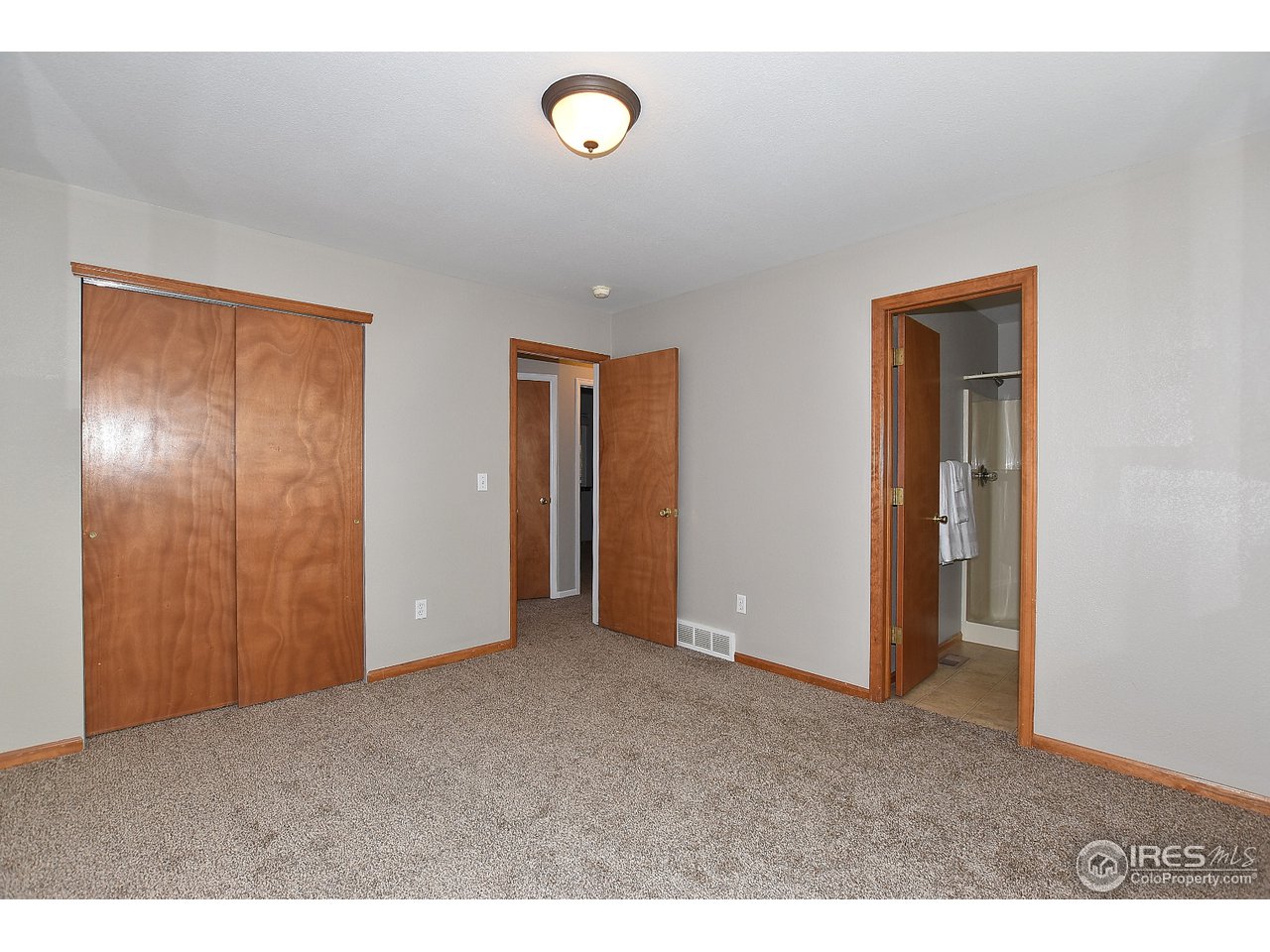 622 East 4th St Road Eaton, CO 80615 - Photo 19 of 40 Master view to hallway and 2 other bedrooms