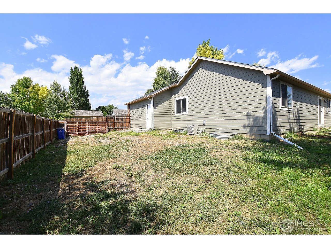 622 East 4th St Road Eaton, CO 80615 - Photo 39 of 40 Side view with large gate
