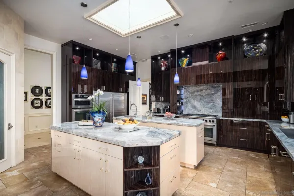 a living room with furniture a table and a fireplace