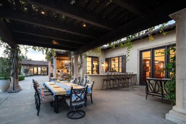 a view of a dining table and chairs in the patio