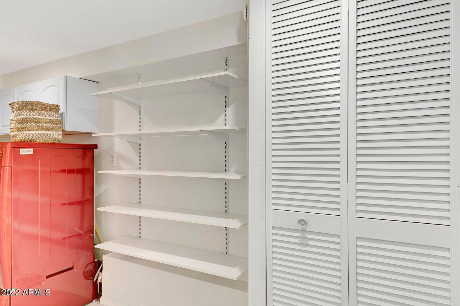 326 West Granada Road Phoenix, AZ 85003 - Photo 14 of 37 a view of a room with shelves on the wall and a window