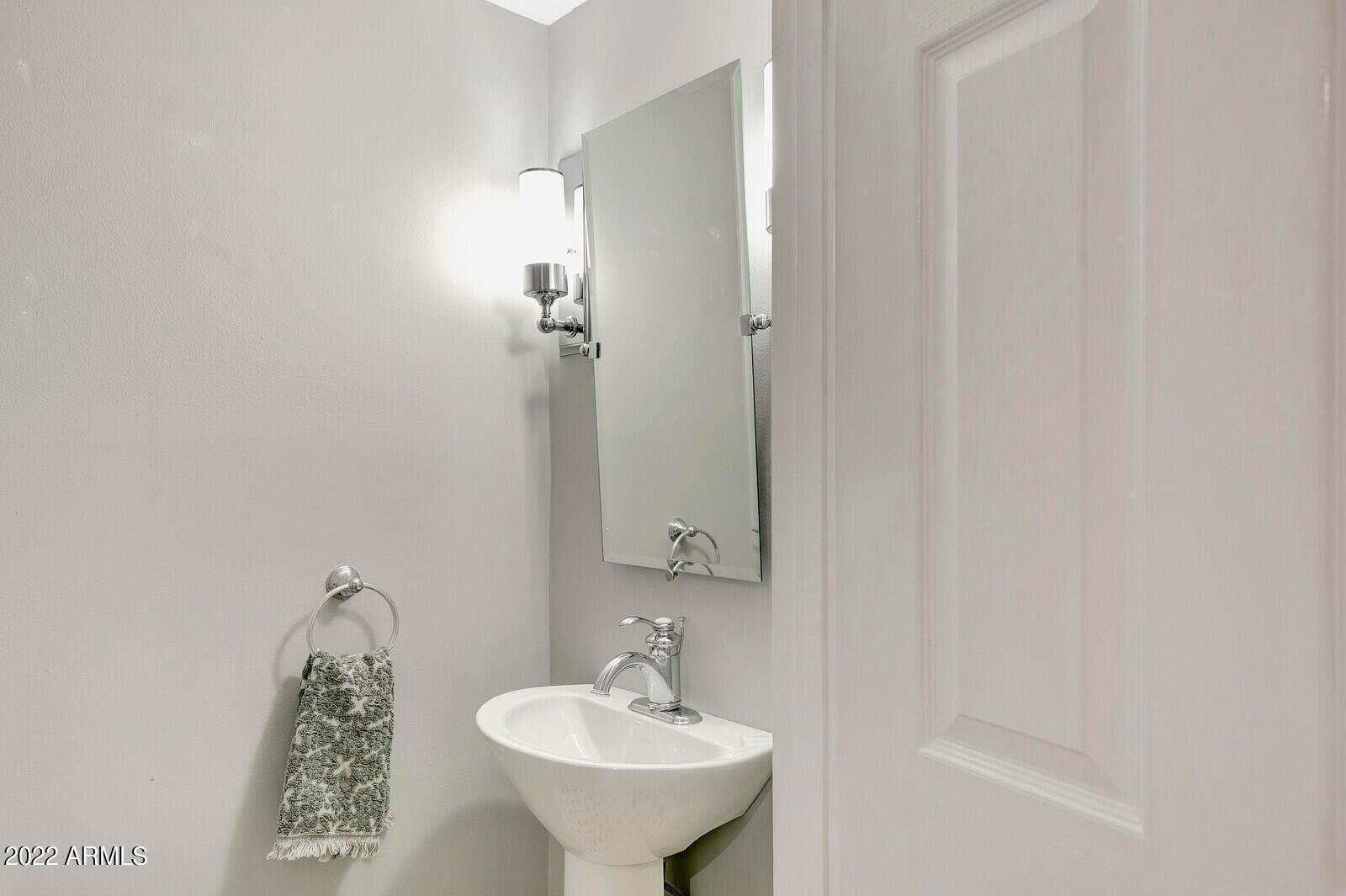 326 West Granada Road Phoenix, AZ 85003 - Photo 15 of 37 a bathroom with a sink a mirror and shower