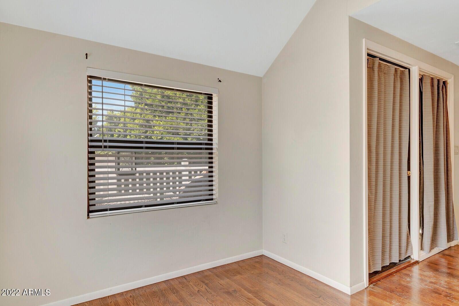 326 West Granada Road Phoenix, AZ 85003 - Photo 29 of 37 a view of an empty room with wooden floor and a window