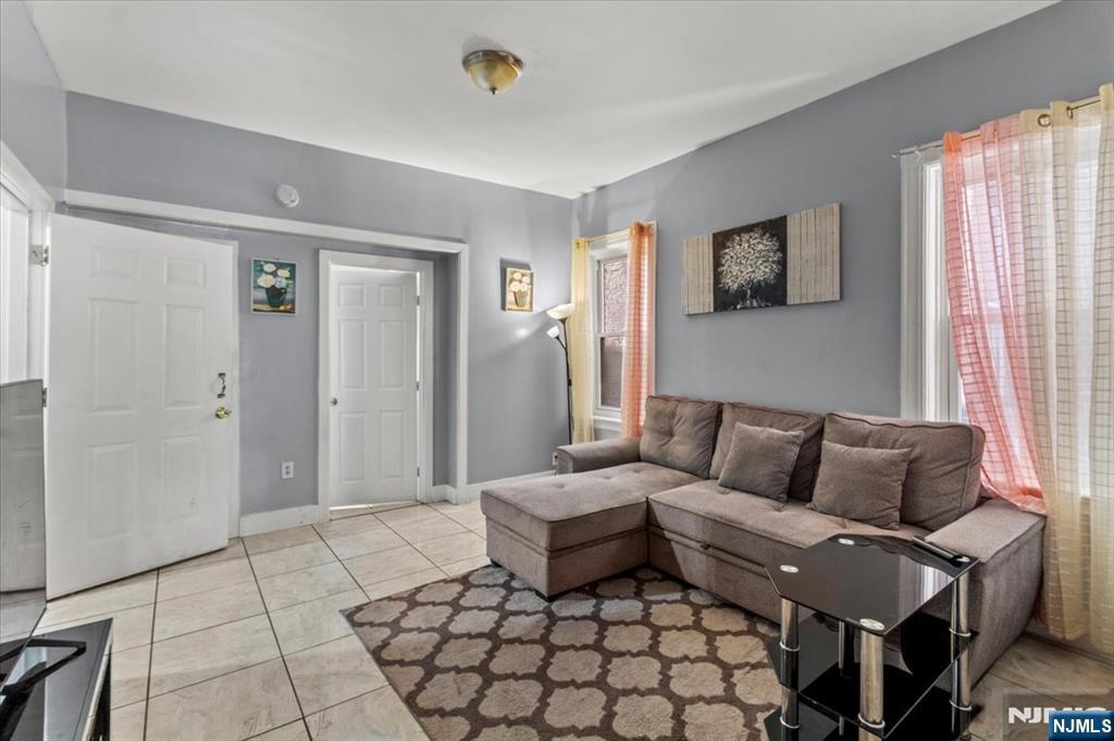 331 Market Street Paterson, NJ 07501 - Photo 18 of 25 a living room with furniture and a window