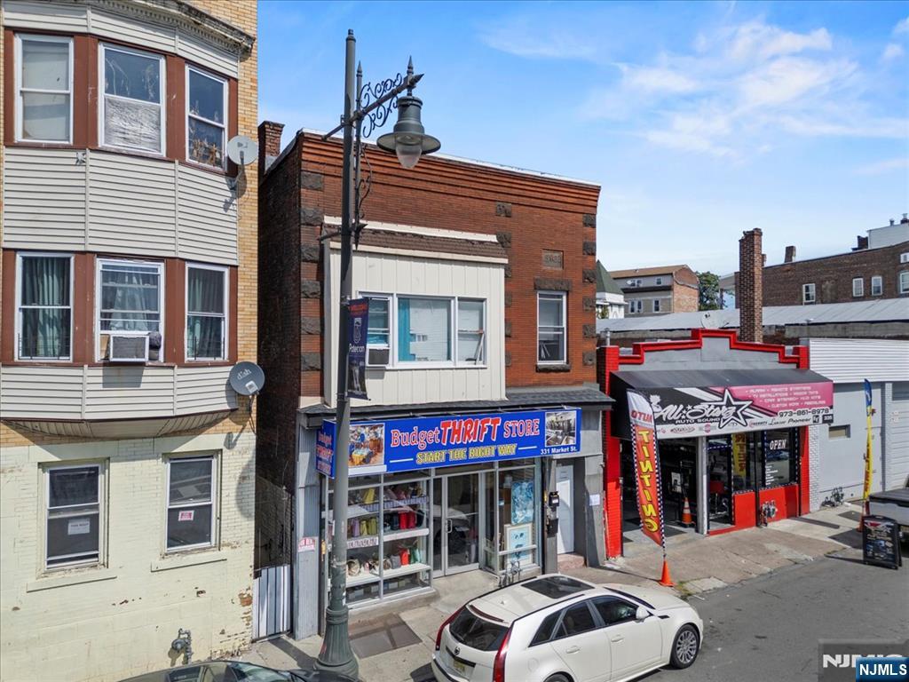 331 Market Street Paterson, NJ 07501 - Photo 2 of 25 a front view of a building with street