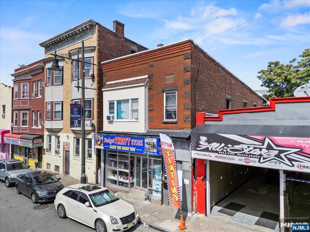 331 Market Street Paterson, NJ 07501 - Photo 3 of 25 a front view of retail shops