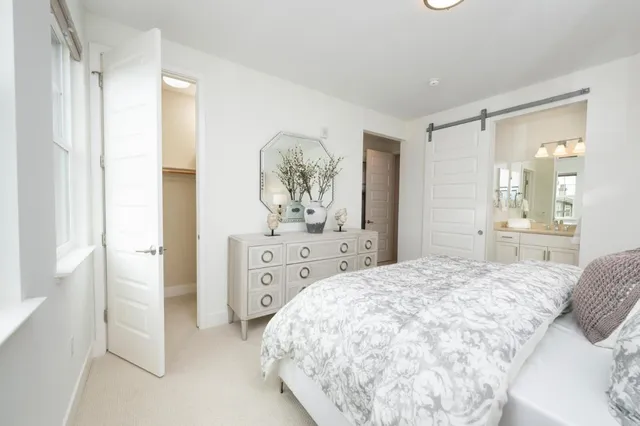 a bathroom with a shower sink and mirror