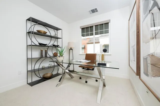 a bedroom with bed and window