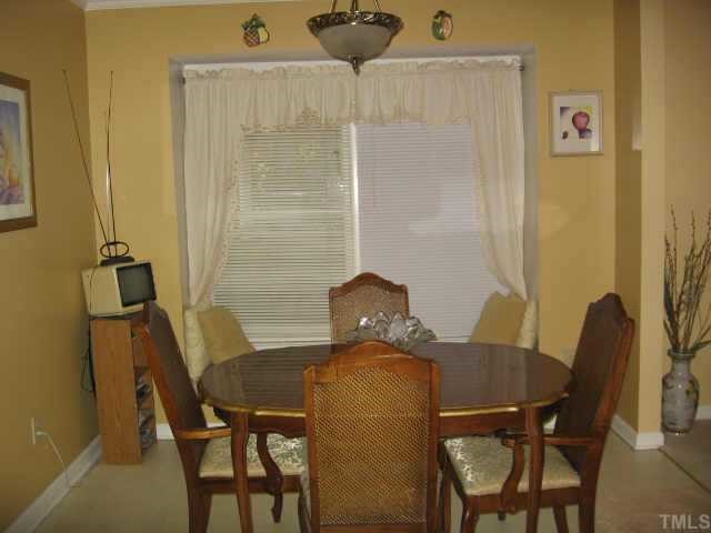 4500 Lafferty Court Raleigh, NC 27616 - Photo 6 of 9 a view of a dining room with furniture and wooden floor