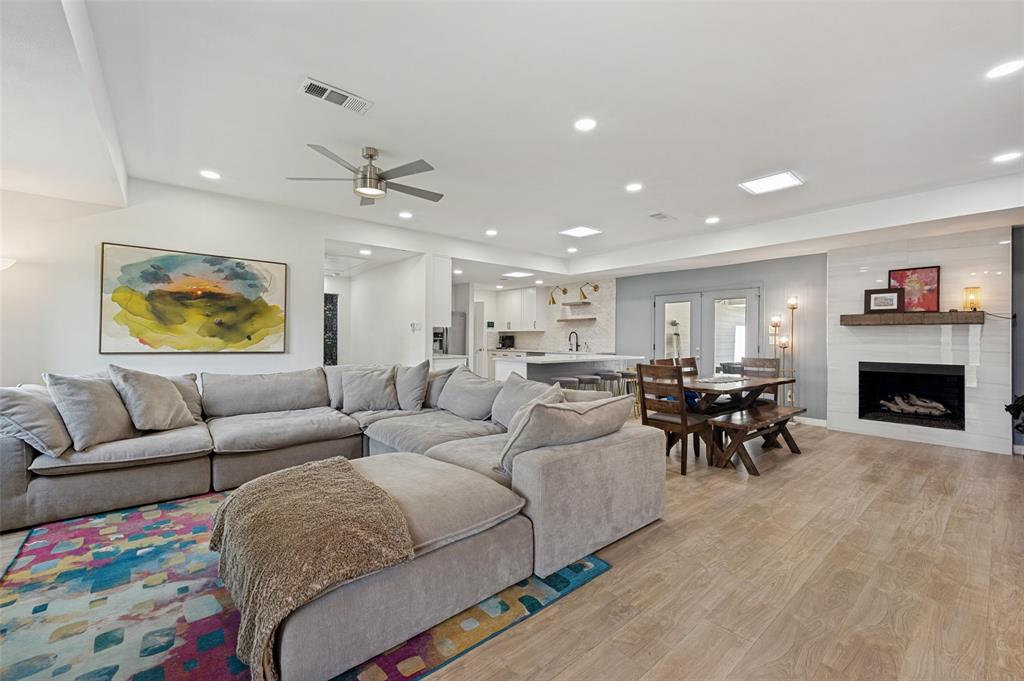 3619 Merrell Road Dallas, TX 75229 - Photo 6 of 26 Spacious open-concept living area featuring wood-finish flooring, a contemporary ceiling fan, and recessed lighting