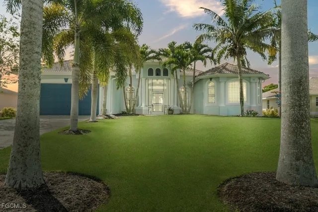 a front view of a house with garden