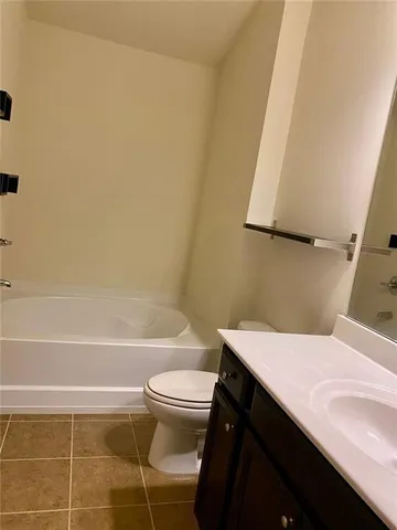 a bathroom with a sink a toilet and bathtub