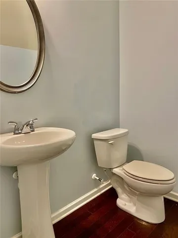 a bathroom with a toilet and a sink