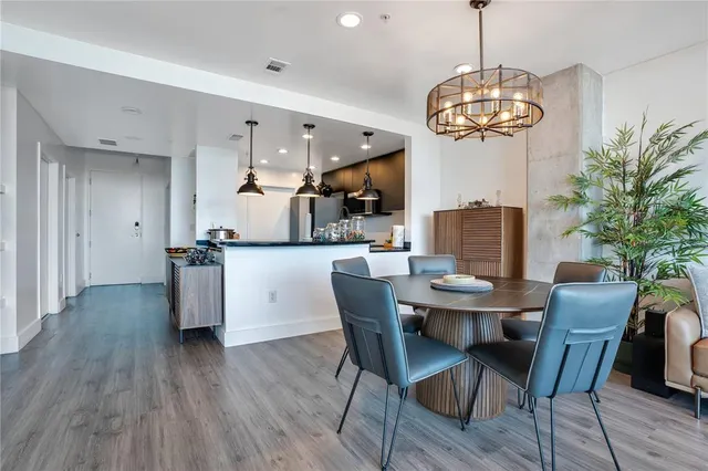 a view of a dining room with furniture window and wooden floor